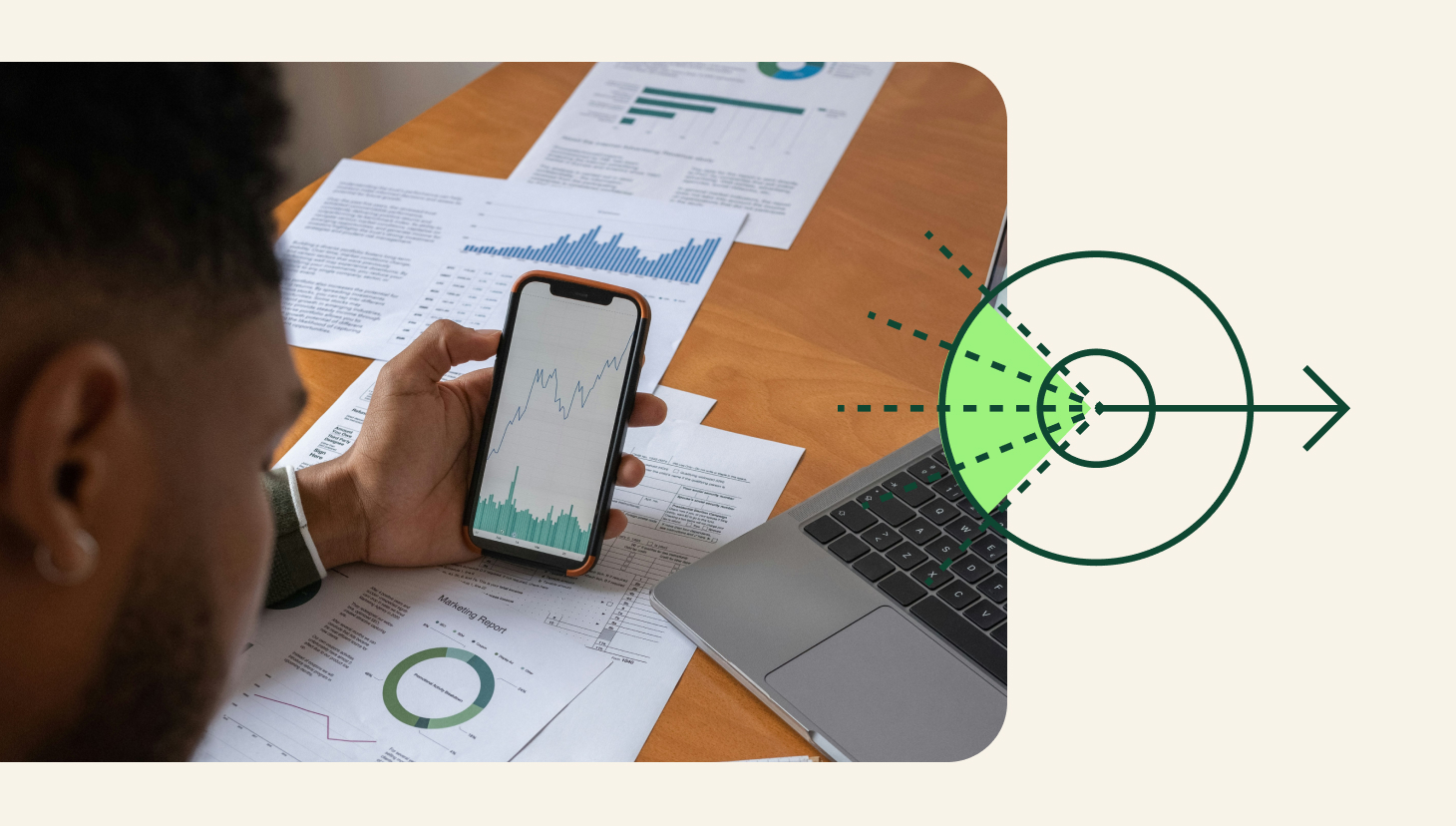 sales data management, image of closeup of someone looking at phone which reveals business charts