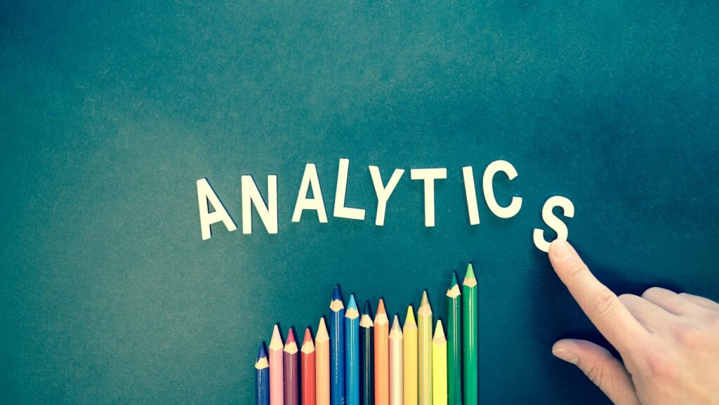 sala data analysis blog - image of colored pencils pointing up to the word "analytics"