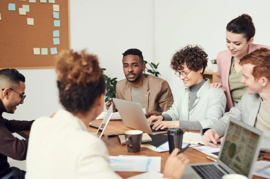 sales audit, image of folks around a conference table working