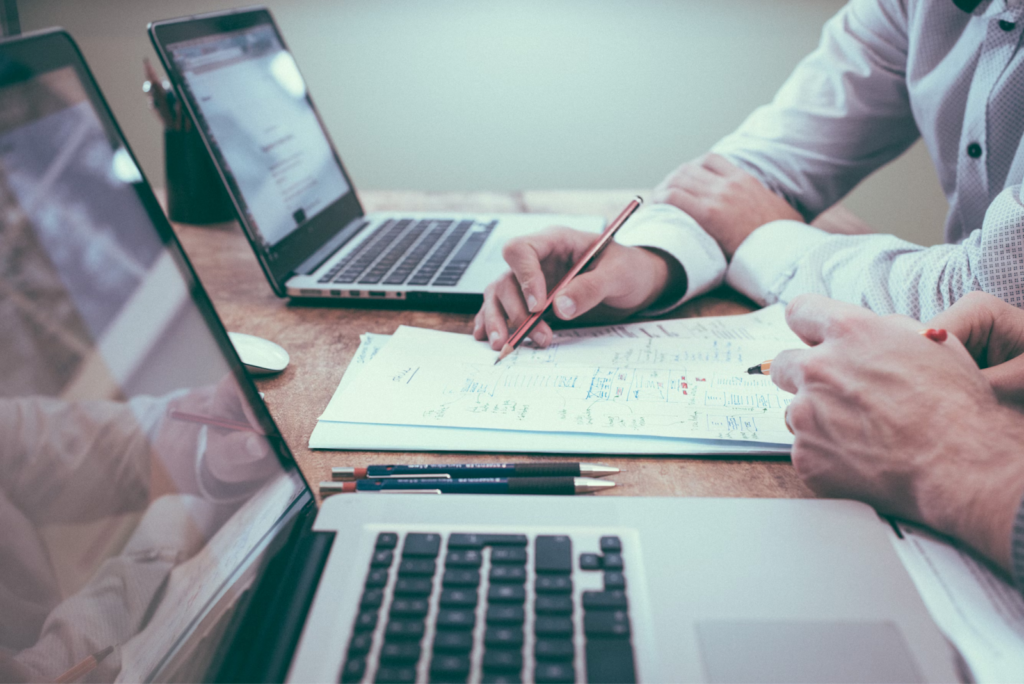 close up of people working at a desk