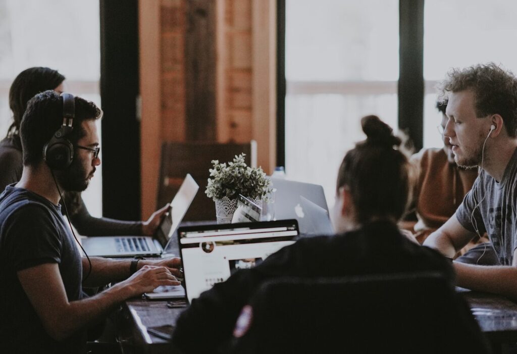 co-working table filled with teammates working